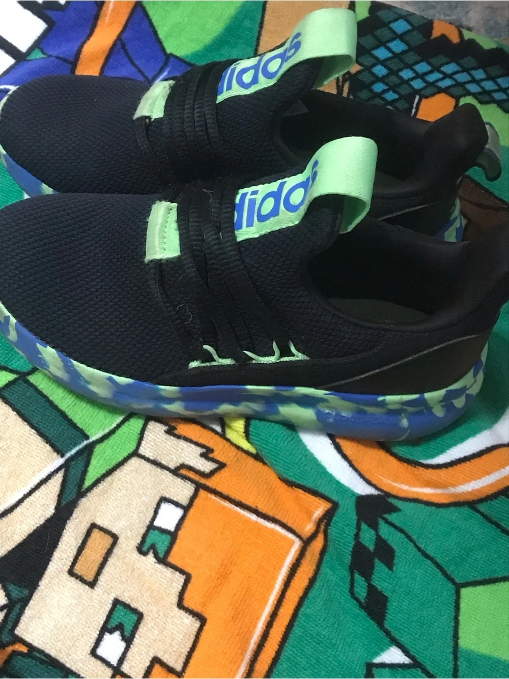 Adidas Kids Black Sneakers with Neon Green and Blue Patterned Sole